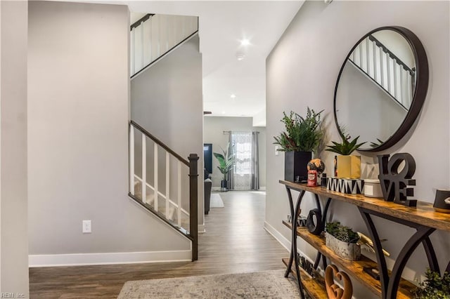 entrance foyer featuring stairs, recessed lighting, wood finished floors, and baseboards