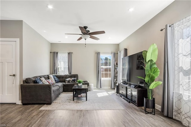 living room with ceiling fan, recessed lighting, wood finished floors, and baseboards