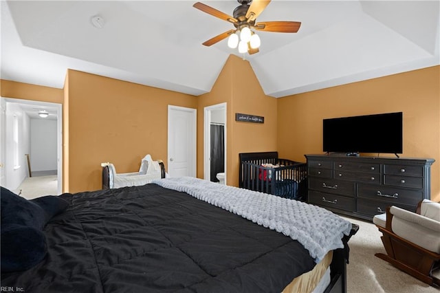 carpeted bedroom featuring lofted ceiling and ceiling fan