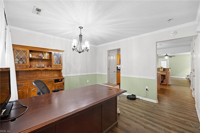 home office featuring ornamental molding, dark wood-type flooring, visible vents, and baseboards