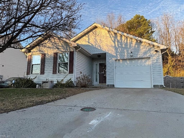 view of front of home with a garage and driveway