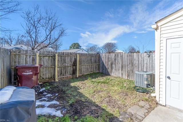 view of yard with a fenced backyard and cooling unit