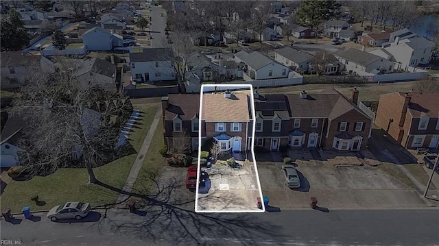 birds eye view of property with a residential view