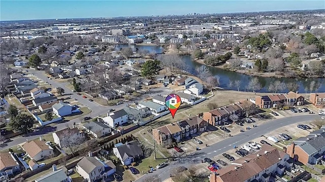 bird's eye view featuring a water view and a residential view