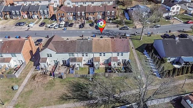 birds eye view of property with a residential view