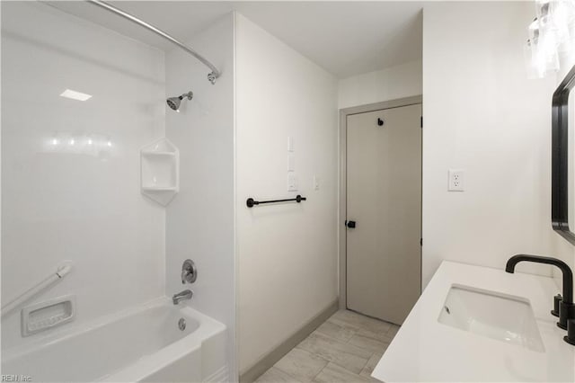 bathroom with shower / washtub combination, marble finish floor, and vanity