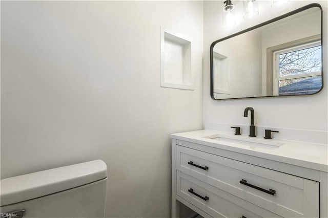 bathroom with vanity and toilet