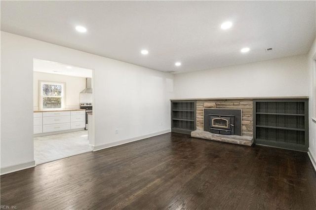 unfurnished living room with a fireplace, wood finished floors, and recessed lighting