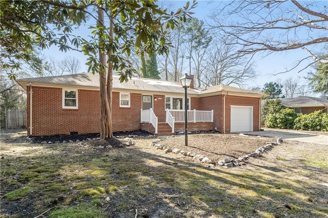 ranch-style house featuring a garage, concrete driveway, and brick siding