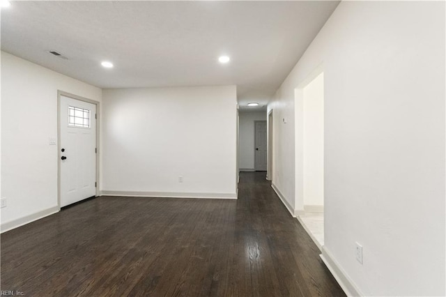 interior space featuring dark wood-style floors, baseboards, and recessed lighting