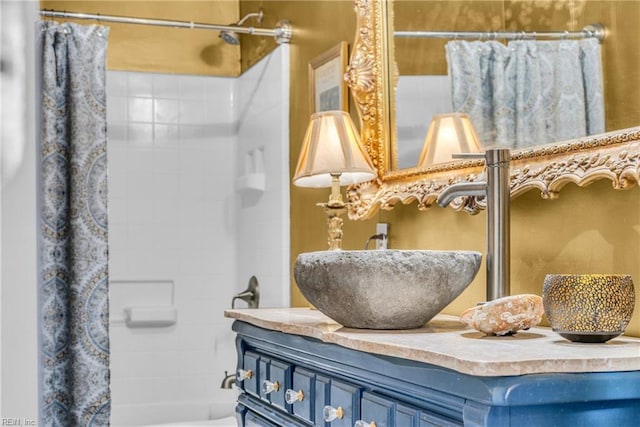 bathroom with shower / bath combination with curtain and vanity