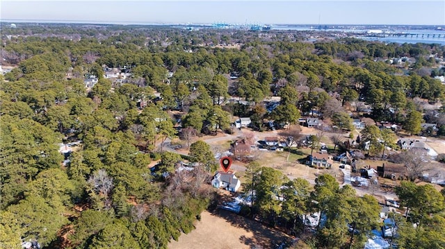 bird's eye view featuring a wooded view