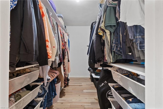 spacious closet with wood finished floors