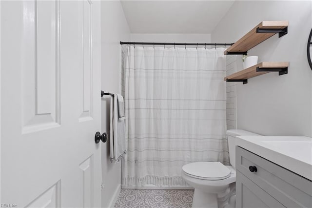 full bathroom featuring toilet, vanity, a shower with shower curtain, and tile patterned floors