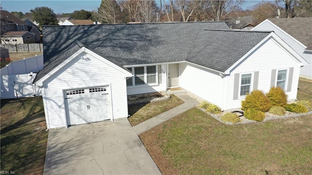 view of front of house featuring a garage, fence, concrete driveway, roof with shingles, and a front lawn