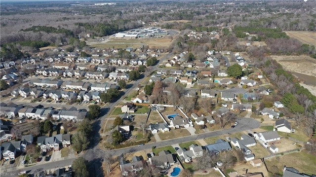 birds eye view of property with a residential view