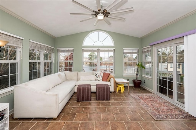 sunroom / solarium with a ceiling fan, a water view, and vaulted ceiling