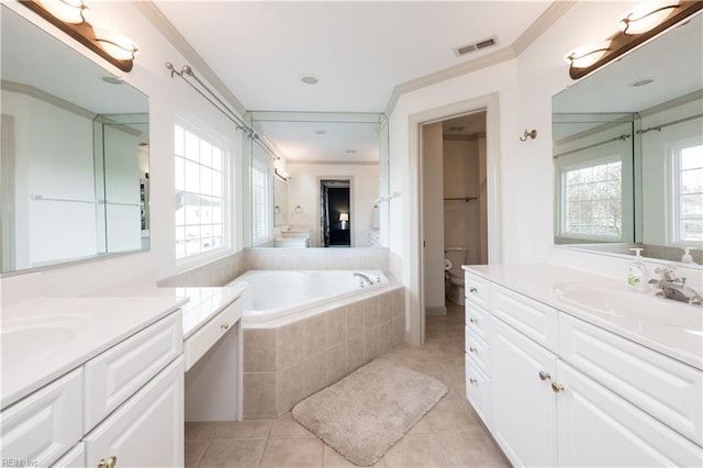 bathroom featuring a sink, plenty of natural light, visible vents, and tile patterned flooring