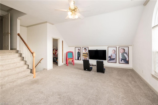 unfurnished living room with lofted ceiling, a ceiling fan, and carpet flooring