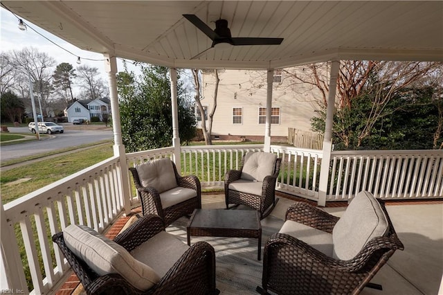 wooden deck with ceiling fan, a porch, and an outdoor hangout area