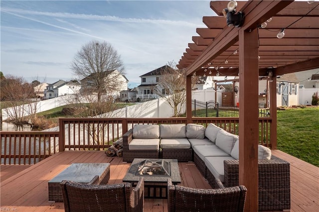 wooden terrace featuring an outdoor living space with a fire pit, a residential view, fence, a yard, and a pergola