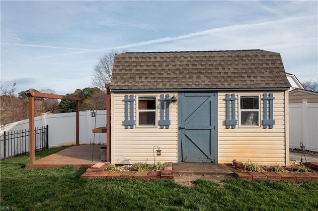 view of shed with a fenced backyard