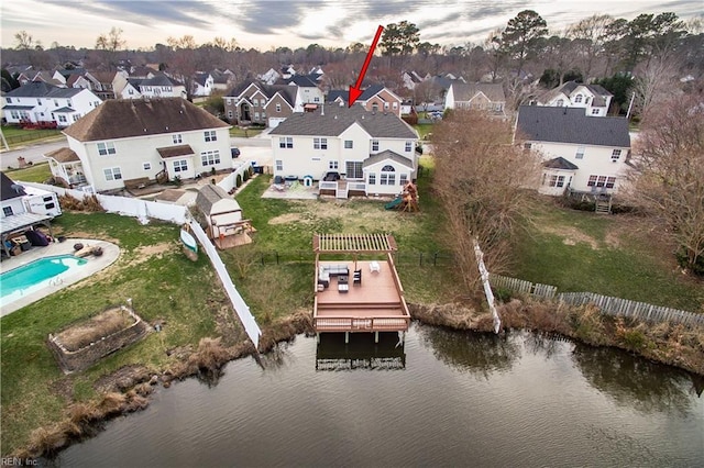 bird's eye view featuring a water view and a residential view