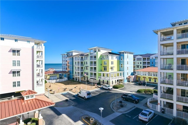 view of property featuring uncovered parking