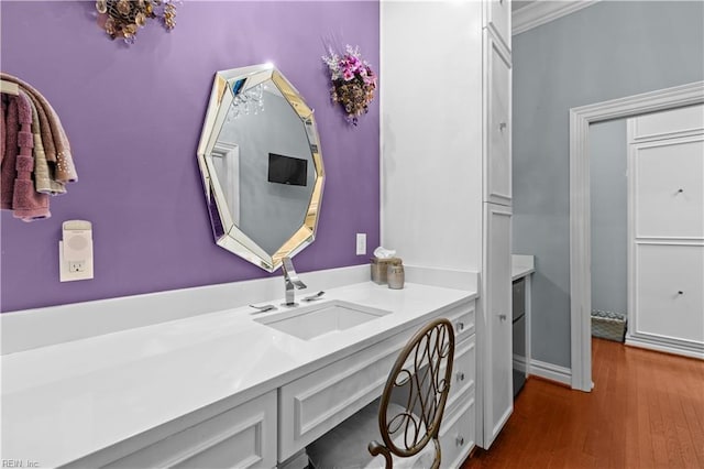 bathroom featuring vanity and wood finished floors