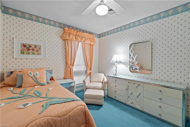 bedroom with a textured ceiling, carpet, visible vents, and wallpapered walls