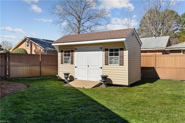 view of shed featuring a fenced backyard