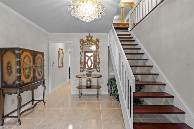 stairs with a chandelier, tile patterned flooring, crown molding, and baseboards