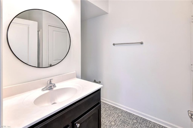 bathroom with vanity and baseboards