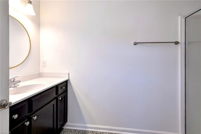 bathroom featuring baseboards and vanity