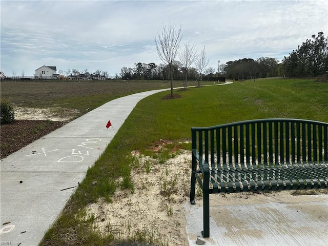 view of home's community with a lawn