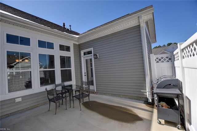 view of patio / terrace with outdoor dining space and fence