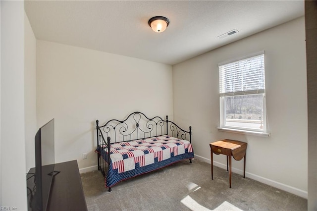 bedroom featuring carpet, baseboards, and visible vents