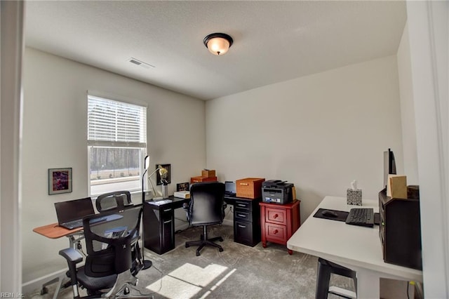 carpeted home office featuring visible vents