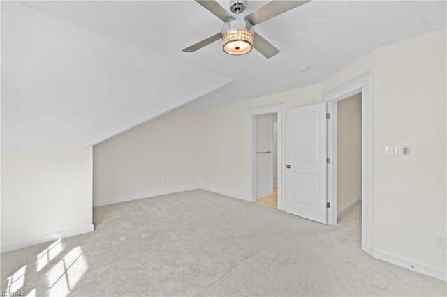 additional living space featuring ceiling fan, baseboards, vaulted ceiling, and carpet flooring