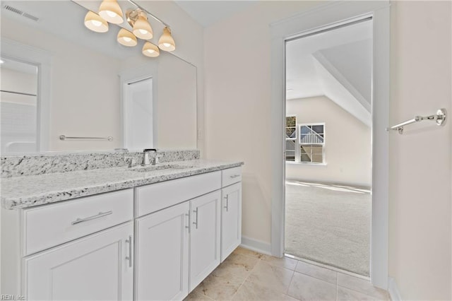 bathroom with baseboards, visible vents, lofted ceiling, vanity, and a chandelier