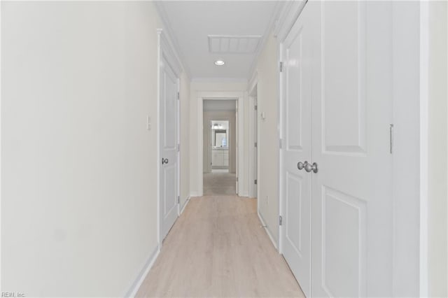 hall featuring recessed lighting, visible vents, light wood-style flooring, and baseboards