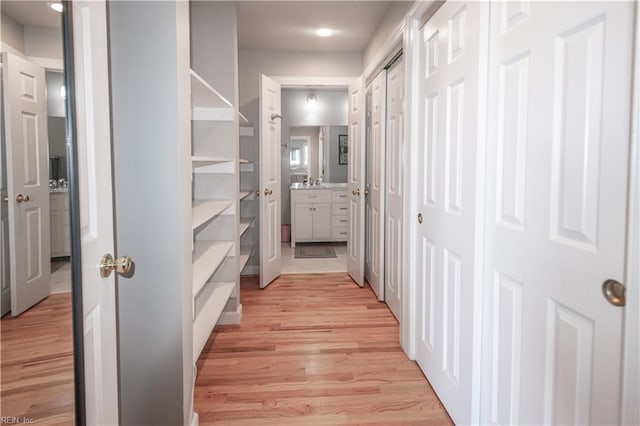 hallway with light wood-style flooring