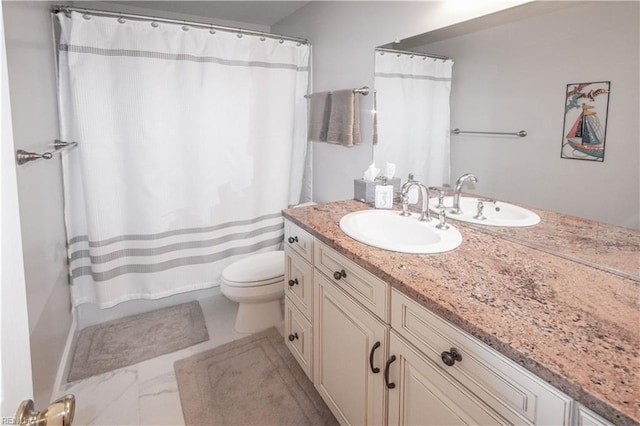 full bathroom with toilet and vanity