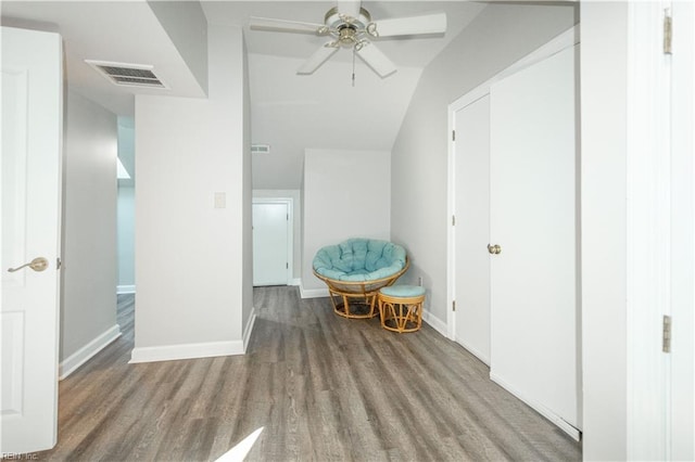 unfurnished room with baseboards, visible vents, ceiling fan, and wood finished floors