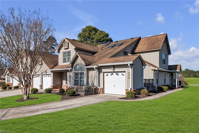 view of front of house featuring a garage, a shingled roof, a front lawn, and concrete driveway