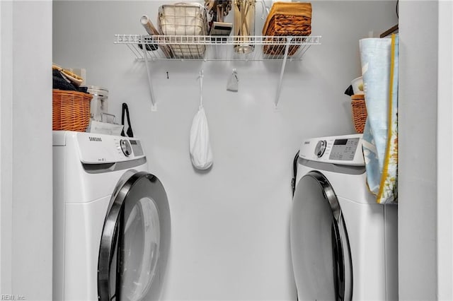 laundry room featuring laundry area and washer and clothes dryer