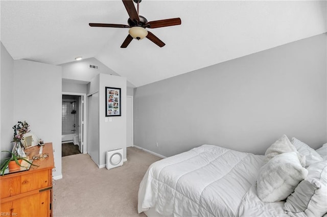 bedroom featuring baseboards, visible vents, a ceiling fan, light colored carpet, and lofted ceiling