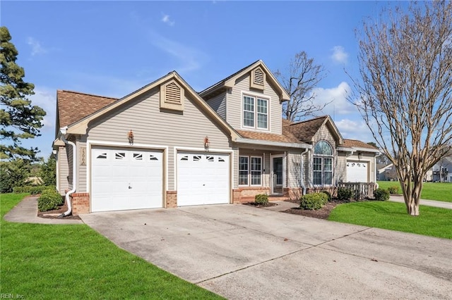 traditional-style home with a garage, concrete driveway, roof with shingles, a front lawn, and brick siding