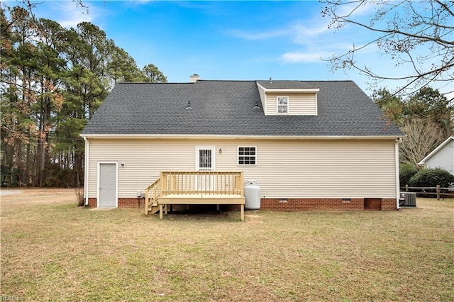 rear view of property featuring crawl space, roof with shingles, a lawn, and a wooden deck