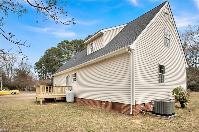 view of side of home featuring a wooden deck, roof with shingles, crawl space, a yard, and central air condition unit